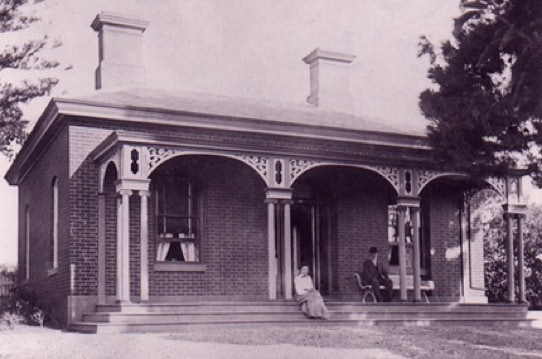 By Malcolm Qualtrough  The house at 237 (Later 44) Belle Vue Road Golden Square Bendigo was home to Henry Qualtrough and his wife Elsie. They raised seven children in the house. Eldest son Jack lived on the Porter Street side next door. Youngest son Alan and wife Betty built a house in 1961 which they called ‘ALBET’ in 1960 on the top side.  Henry is descended from James Qualtrough born 1832.  His mother was Alice Jane Qualtrough   Probably in the photo above are Mr and Mrs Lisle This photo above is from the State Library of Victoria above gives the date 1854 - Colour added 2021 by Malcolm Qualtrough - shows what is most likely the Union Mine Chimney, see 1886 map below.  This house lies on an allotment granted to R (Robert) Lisle in 1865. Robert Lisle was a pioneer of the Bendigo District. His father John married , at Lowick, Northumberland in 1791 Anne Coxon from Cartington. Their family of six children included Robert (1821) who married, at Longhoughton in 1848 Mary Straughan. In 1841 Mary was one of six servants living with Thomas Browne ’of independent means’ and his family in Amble but in 1851 Robert and Mary were in Newcastle upon Tyne where Robert was a Joiner’s journeyman.  The discovery of alluvial gold at Ballarat, Victoria in 1851, and a second find shortly afterwards at Bendigo, saw a great rush of Australians to the digging to try to make their fortunes.Robert and Mary sailed to Australia ,possibly amongst the 284 passengers aboard the ‘Washington Irvine’, in December 1852. After a short stay in Ballarat the couple moved to Bendigo in 1856 where Robert joined the ranks of gold diggers.  They arrived with very little but by 1858 Robert was one of the six owners of the Union Company Mine, Golden Square. All were members of the Golden Square Methodist Church of which Robert became a founder member after a deeply moving experience. Later he took a share in Bruce’s Crushing Mill selling this in 1861 to finance a trip to the ‘old country’. He, and Mary, returned to Australia in 1862 amongst the 481 passengers aboard the S.S. Great Britain.  Robert and Mary celebrated their Golden wedding anniversary in 1898 when 250 were invited ‘to partake of a social cup of tea with two well known residents of Bendigo’ in the Wesleyan school room.  The house was built about 1865.   Robert also purchased a Lot adjoining on the north, which in the 1950s a house was built for Henry and Elsie’s youngest son Jack Qualtrough and his wife Phyllis.  Early Maps below show the Lots just south of the United Bell Vue Company Mine and just west of Poverty Gully in 1871 and 188. The area was known as Dairy Hill, on account of the Dairy Hill United Company. For a description of the area see the article on this site - memories of the 1960s by Malcolm Qualtrough.  Directories of the period list Robert Lisle as a miner in Golden Square.   Robert Lisle Obituary from the Argus 8th July 1911:  Mr. Robert Lisle, mining pioneer, and a liberal supporter of the Golden Square Methodist Church, died, aged 91 years. He came to Victoria from Northumberland in 1854, and was for some years mining on the Sheepshead Reef.   Today's nearby Lisle Street presumably commemorates his name.  Lisle, listed as a quartz miner, owned a house and land on the Sheepshead Reef early in the 1860s.  By 1865 he owns and occupies this property and continued to do so until early this century, when he was described as a ‘mine manager.' Lisle is thought to have partnered Abraham Harkness in the Victoria Foundry.  Messrs. Harkness and Co.'s Victoria Foundry, Golden Square, was commenced in a small way in 1858 by four practical workmen, Messrs. Irving, Espie, Braddish and Arundel. The firm prospered, but several changes occurred in the management, until in 1870 it consisted of Messrs. Ruddock and Harkness. Subsequently Messrs. R. Allingham and R. Lisle  succeeded Mr. Ruddock in the firm, but they retired in 1881 and 1886, leaving Mr. Harkness sole proprietor.  Lisle was one of the instigators of Methodism at Golden Square in the 1850s. He helped purchase a site for the new stone church (open December, 1859), which followed the fust 1852 strycture. The new 1870 church benefactors included Richard Allingham and Union claim holders (Lisle?).  Robert’s sistor lived in Panton St, Golden Square, her obituary from the Bendigo Advertiser states: Mrs. Susannah Cockburn, wife of Mr. John Cockburn, died on Thursday night at her residence, No. 45 Panton-street, Golden-Fix this text square, at the advanced age of 84 years.  The deceased was an estimable lady, of a kind and unassuming nature. She was a sister of the late Mr. Robert Lisle, an old Bendigo pioneer, of Bell Vue-road. She was born at Northumberland, and had lived at Golden-square for 25 years. She made many friends, and was a loyal adherent and supporter of the Golden-square Metho- dist Church. Besides her husband, two   sons and one daughter are left to mourn their sad loss.   Robert’s brother obituary was printed in the Bendigo Advertiser 29 October 1907: Roger Lisle, aged 79, late of Kangaroo Flat and Golden-square, brother of Robt Lisle, Belle Vue road, Golden-square.  Mr. Roger Lisle, who, alter managing several claims, on the Bird’s Reef, immediately South of the railway line at Kangaroo Flat in the 1860s, went to Queensland, where he assumed the management of the famous Mount Morgan mine.   Mrs Ann Gill, the widow of Thomas Gill, who dies in 1912, a retired farmer from Myers Creek; continued the ownership through the First War into the 1930s, when the Star Building Society was listed as 'owner' and the occupier (and mortgagee?), first James Loy, then John Oualtrough. Oualtrough, a forester lived there, with Elsie Oualtrough, until the 1970s, with Allan Oualtrough owning land beside them in the 1950s.  Description  A double-fronted red brick (painted over) villa, with a hipped- form slate roof and concave-profile verandah. Set side-on to the street and the nearby Poverty Gully, it faces across Lisle's other block, back towards Bendigo town. It also faces the United Belle Vue Company gold mine site. The house's most unusual attribute is the verandah detailing. Paired posts (Ionic) support miniature entablatures, capitals and intricate fret-sawn arch spandrels which recall other notable buildings such as 50 Church Street, Eaglehawk, Falkland House, Long Gully (Vahland & Getzschmann, 1870) and 12 Bannerman Street, Bendigo, (R A Love, 1871).  Openings have segment-arch heads, with indications of contrasting colours in the voussoirs, and the stuccoed chimneys have relatively slim cornice mouldings, typical of mid, rather than late, Victorian-era details.  External Integrity  An early picket fence may survive in an altered form at the frontage (tops cut square) and the brickwork has been painted, albeit a 'brick colour.'  Context  Immediate mature landscape includes the Roman Cypress specimens. Beyond are the gold fields (United Belle Vue, Eureka, Napoleon United, Golden and Poverty Gullies). Other early buildings include 58, 60 and 51 Belle Vue Road.  Landscape  Mature landscape includes' Cupressus torulosa' along the fence line and a large evergreen tree (possibly an’ Arbutus unedo') which is contributory.  Significance  Architecturally, the house is distinguished by its ornate early verandah, potentially its brickwork and its adverse siting, which points to its historical associations and lends it prominence, sited on a minor hill.  Historically, it is also contemporary with the surrounding major gold mining field and provides valuable built components to the historical importance of this part of the Bendigo field.  Its creator and long-term occupier, Robert Lisle, was part of the Golden Square mining fraternity and co-financier of the Methodist Church in the locality.  The house is basically of five rooms.   Note the positions of the chimneys and the curved wall in the corridor. The shared fire-place cavities were in the form where the wrought iron covers and fire grills on each side of the wall shared the chimney. The fireplace was very effective at heating the room. The author can remember staying occasionally in the front room snug and secure in Winter time.  The early date of this cavity wall construction house is enough to make it a house of considerable significance but Love's choice of a novel means of bonding the inner to the outer walls makes it of international significance in the history of building technology.   Cavity wall construction had been used since at least the early part of the nineteenth century in Britain. but it was not generally accepted by builders and architects until the 1920s. Restoration writer Ian Fvans. stated that Australia’s first cavity brick walls are in buildings in the Victorian towns of Stawell and Bendigo. constructed by American architect R.A. Love during the late 1860s and early 1870s. Lewis has claimed for Love the distinction of being the architect of the first true cavity wall buildings in Victoria based on his work in Stawell.  This Bendigo example is five years earlier, but it is not however. the first known example in Bendigo. Earlier in 1864. Vahland and Getzschmann had built St Monica's Church in Kangaroo Flat with 100 mm cavities in the walls. They had bonded the walls at metre intervals by overlapping alternating header bricks from the inner and outer waIls. The construction was revealed when the church was demolished without a permit. The presence of the header bricks mitigated the effectiveness of the cavities to exclude moisture.  In the Lisle house. the front and side walls are about 275 mm thick with a 70 mm cavity. The inner and outer walls are tied using header bricks every second brick in every second course, providing a very secure bond.  It also allows air to circulate freely around each header brick. reducing the tendency for moisture to penetrate to the inside surface of the wall. It is possible that specially made header bricks were used to span the walls as one such brick was found in the garden, but this has not been confirmed by inspection. The closest known published bond is that of Loudon’s hollow wall which uses a cavity with Flemish bond.  It also allows air to circulate freely around each header brick. reducing the tendency for moisture to penetrate to the inside surface of the wall. It is possible that specially made header bricks were used to span the walls as one such brick was found in the garden, but this has not been confirmed by inspection. The closest known published bond is that of Loudon’s hollow wall which uses a cavity with Flemish bond.  The plan of the house is also a departure from the more common double front with central passage. Unusually the sharp corner in the passage has been rounded in recognition that it would be likely to be knocked. Love has given the doorways in the front rooms a classical treatment. He inserted non-opening timber panels which extended the architraves to almost 2.7 metres. which gave the door, when closed, the appearance of being very tall.  The front wall is of triple brick with cavity to give added depth to the entrance door and windows in a wav that characterizes several of Love's later residential buildings. His use of lonic capitals on the verandah posts is also characteristic of some of his later work. Some of the capitals have rotted and been replaced with replicas. A photograph of the house with Mr and Mrs Lisle on the verandah shows three steps extending the full width of the verandah, in the manner Love later used at Colbinabbin and Stanhope homesteads. The steps no longer exist, so they were probably made from timber.  Love designed this house for Robert Lisle a successful mining manager and investor and a staunch member of the Golden Square Methodist Church.  Lisle was honorary clerk of works for the construction of the present church in 1872, so is likely that he took an active interest in the mode of construction of his own home. He died there in 1911.  A recent owner in the 1990s has inserted a stainless steel damp course into the walls and made additions to the rear. but the original building remains essentially intact.  Reference: Robert Alexander Love - Goldfields Architect  Reference: Bendigo and Eaglehawk Heritage Study-Significant site by Graeme Butler and Associates.     